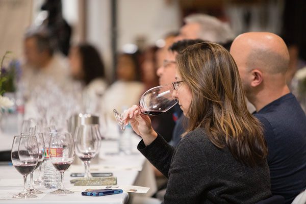 woman smelling the wine