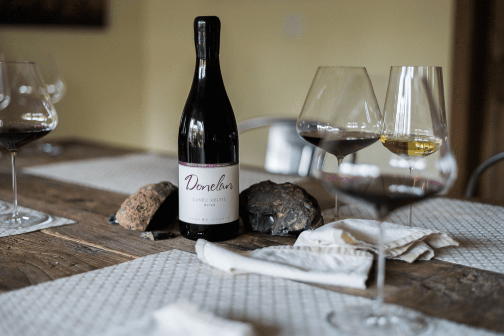 bottle of Donelan Syrah in a wine tasting